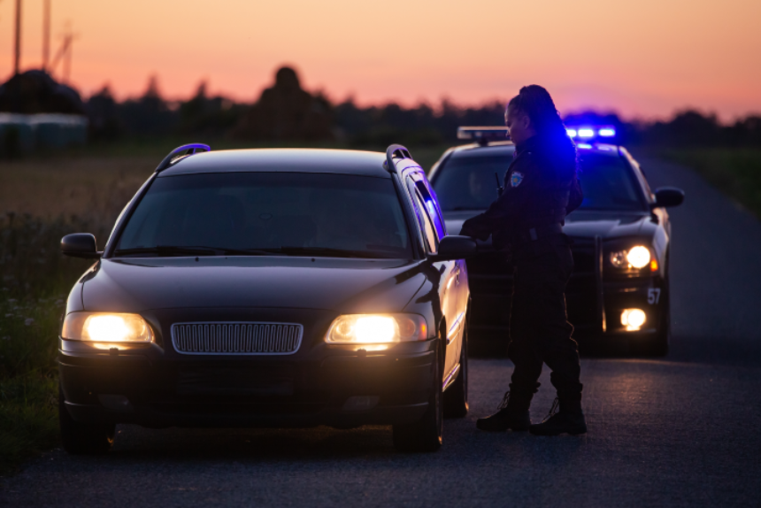 Highway Traffic Patrol Car Pulls over Vehicle on the Road.