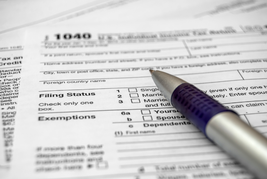 Tax form with pen