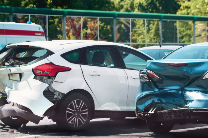 Traffic collision scene with damaged cars