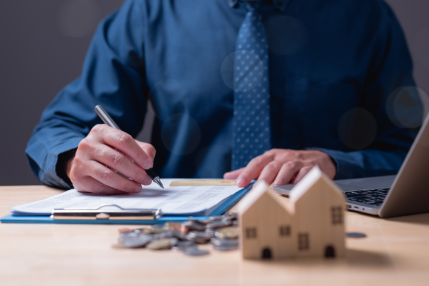 The estate agent's signature on the contract finalized the mortgage agreement, marking a significant investment in the housing property for business purposes.