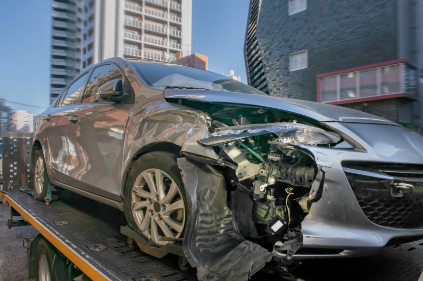 Accident car transported by tow truck