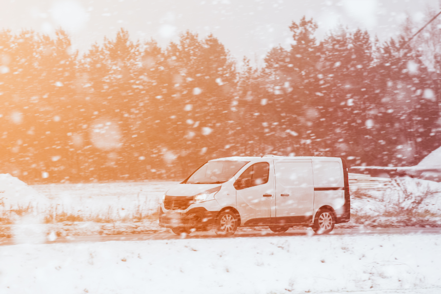 Car speeding on the winter road. Navigating Snowy Roads with Confidence. Equip Your Car with a Reliable Battery and Winter Tires for Safe Family Journeys in Frosty Weather