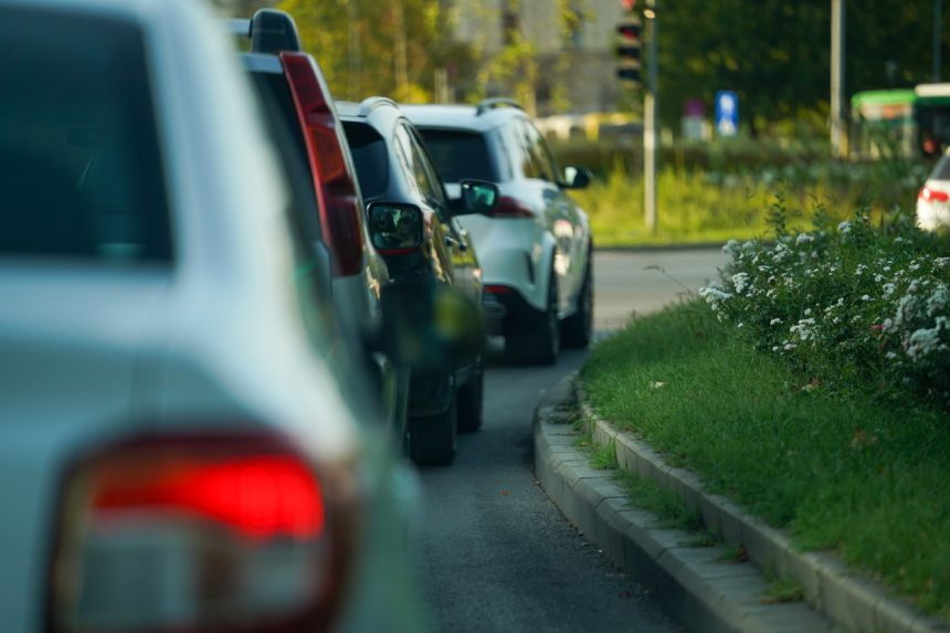 traffic congestion. cars while standing in the queue at the traffic lights. detail. people going to work in the morning. road traffic