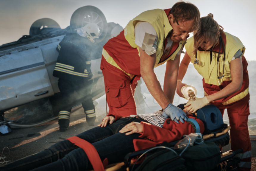 Paramedics Saving Life of a Female Victim who is Lying on Stretchers. They Apply Oxygen Mask, Do Cardiopulmonary Resuscitation / CPR and Perform First Aid