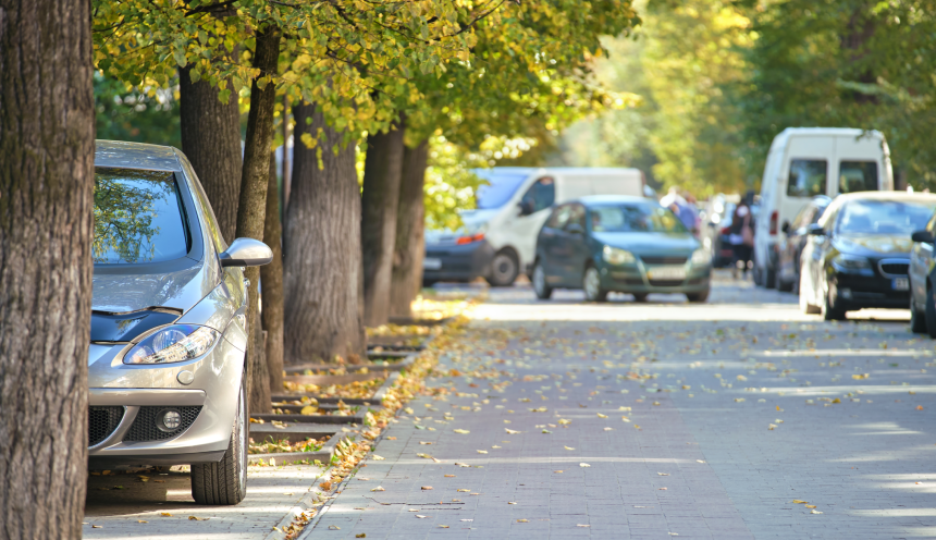 Close up of a car parked illegally against traffic rules on pedestrian city street side