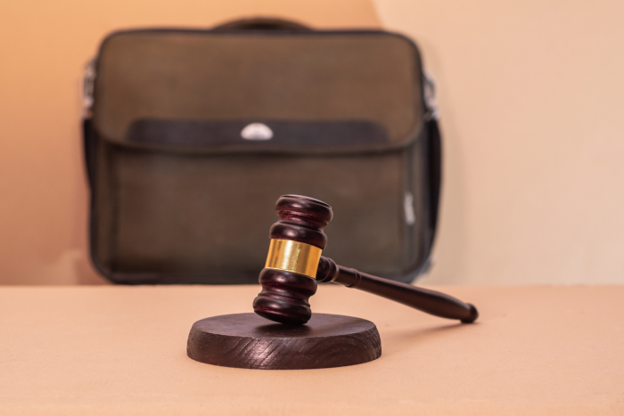 Concept of commercial litigation and legal risks. Judge's gavel with briefcase. Law protecting business. Legislation