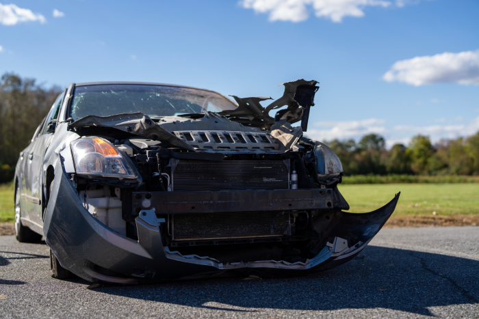 Car accident with broken vehicle. Car accident with smashed front. Car accident with repair concept. Car accident with danger scene