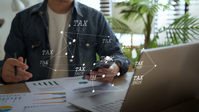 Federal Income Tax Internal Revenue Service IRS Digital tax filing Tax return financial planning analyzing data revenue deductions filing online payment mobile app computer technology. Business tax management economy